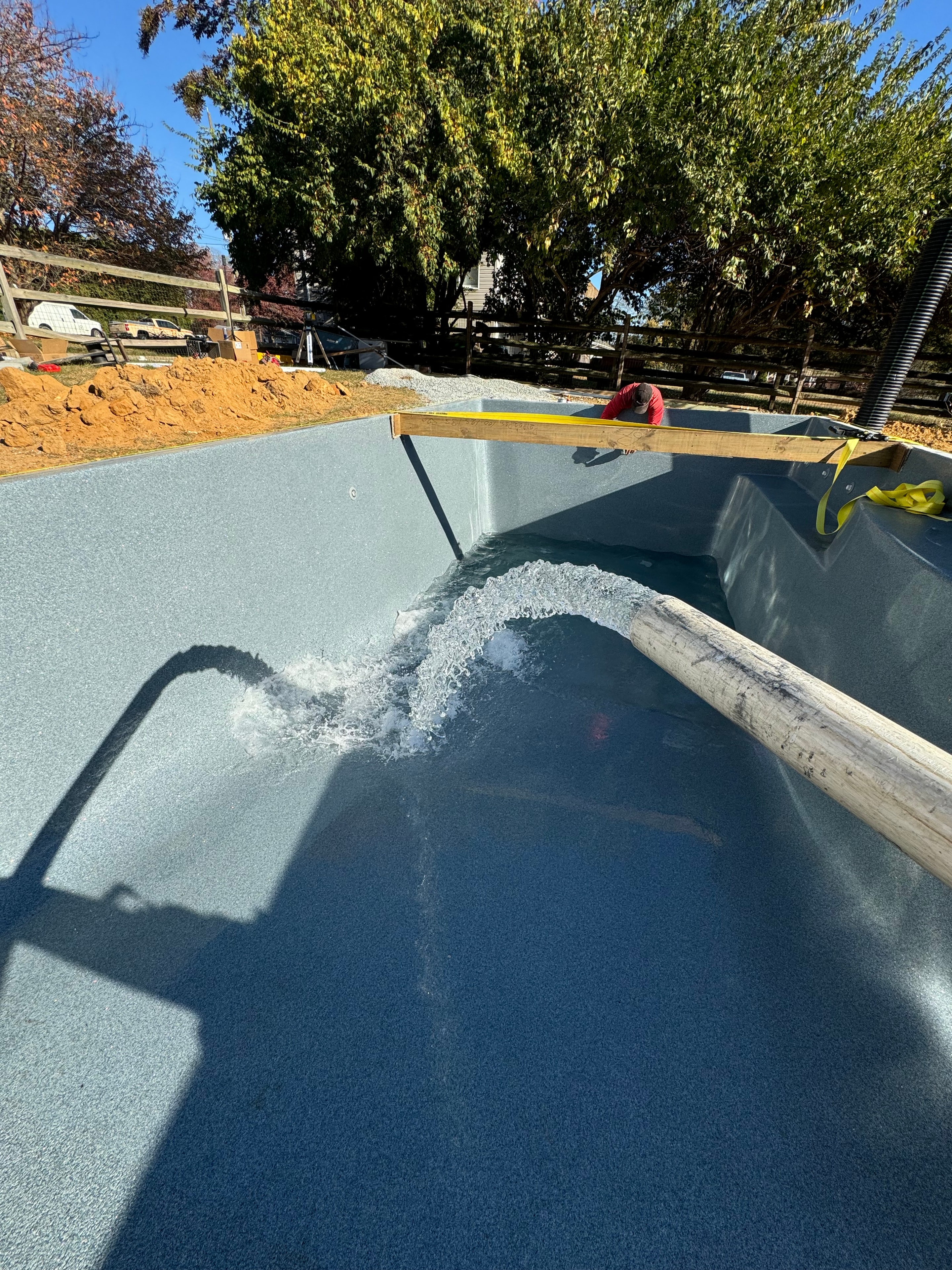 Under construction — pool shell being filled with water for the first time