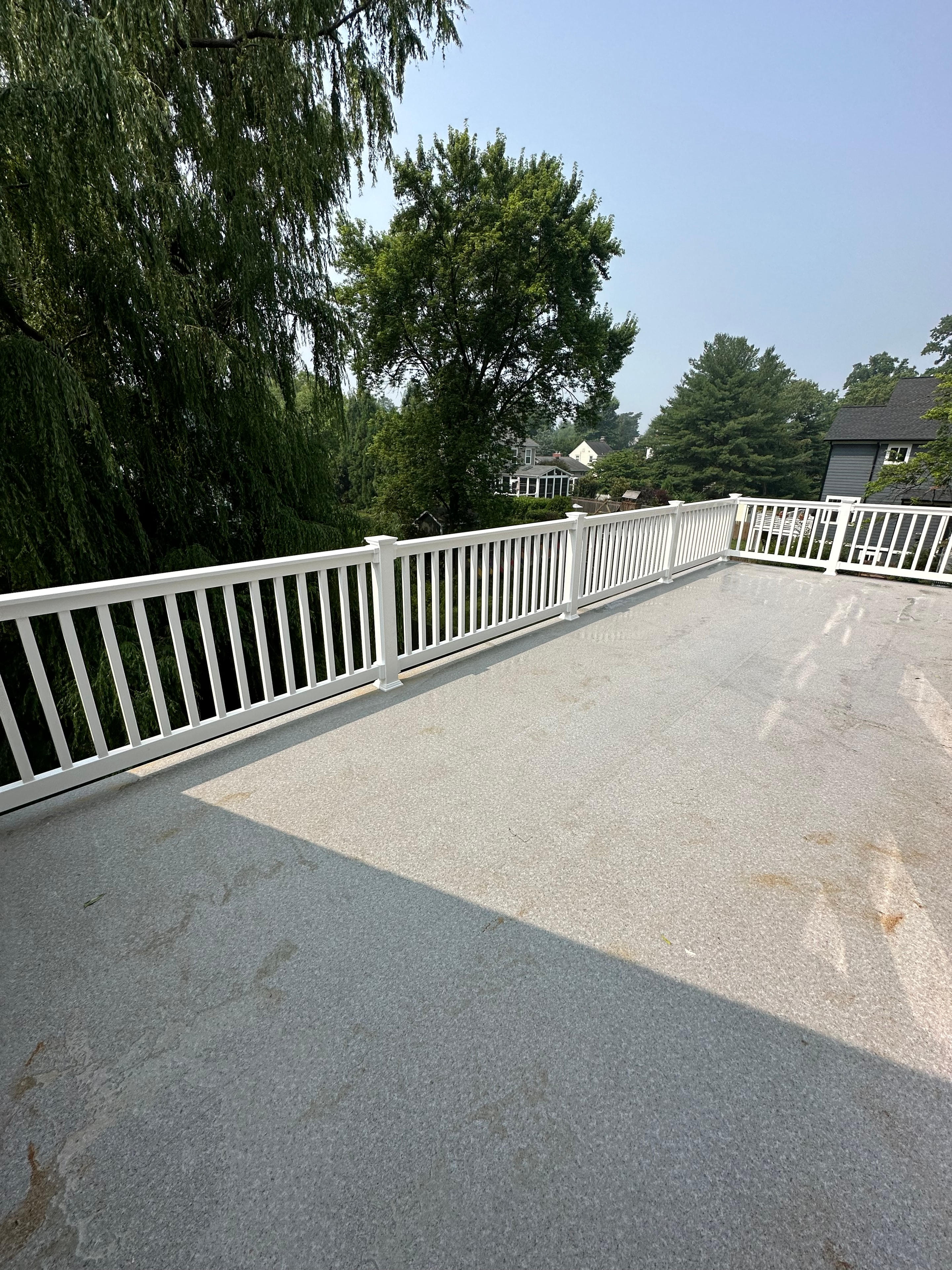 Big Deck Energy - upper deck with Trex boards and white railing