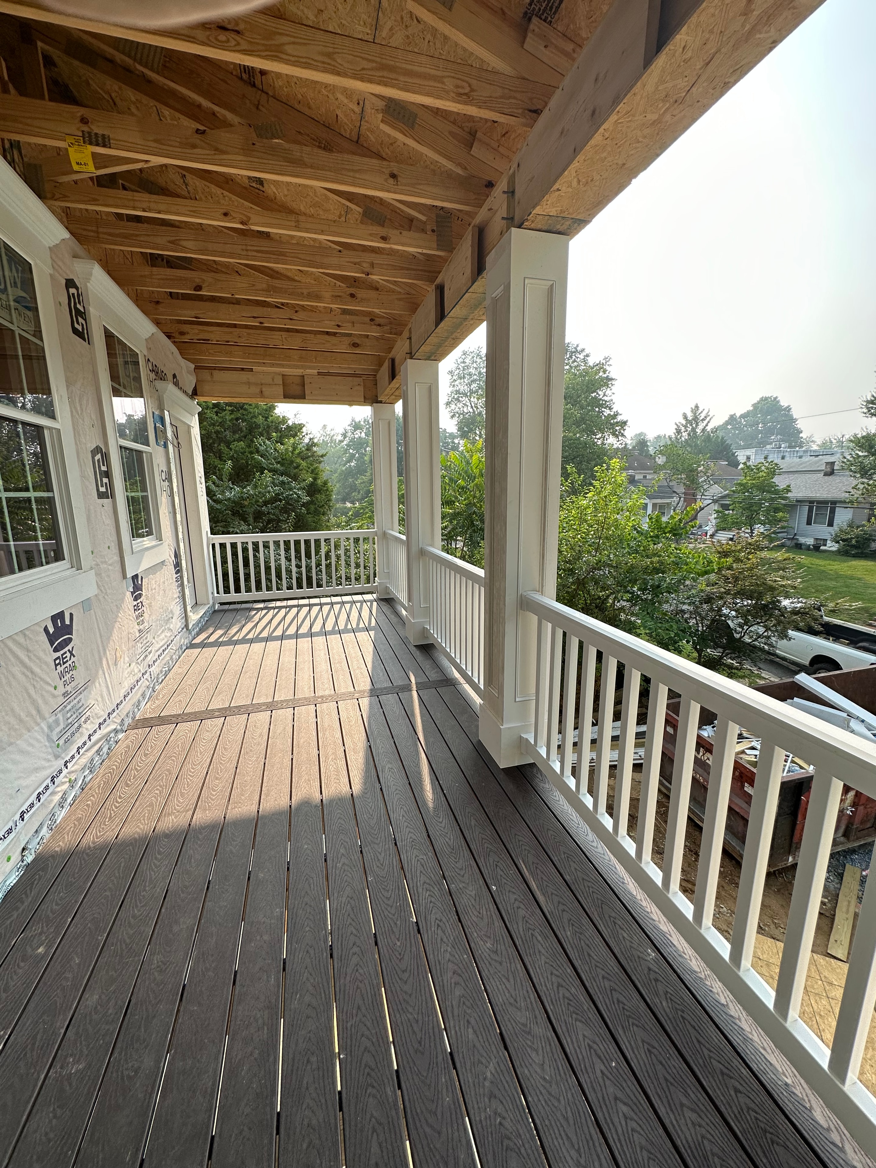 Big Deck Energy - covered porch ceiling and Trex decking close-up
