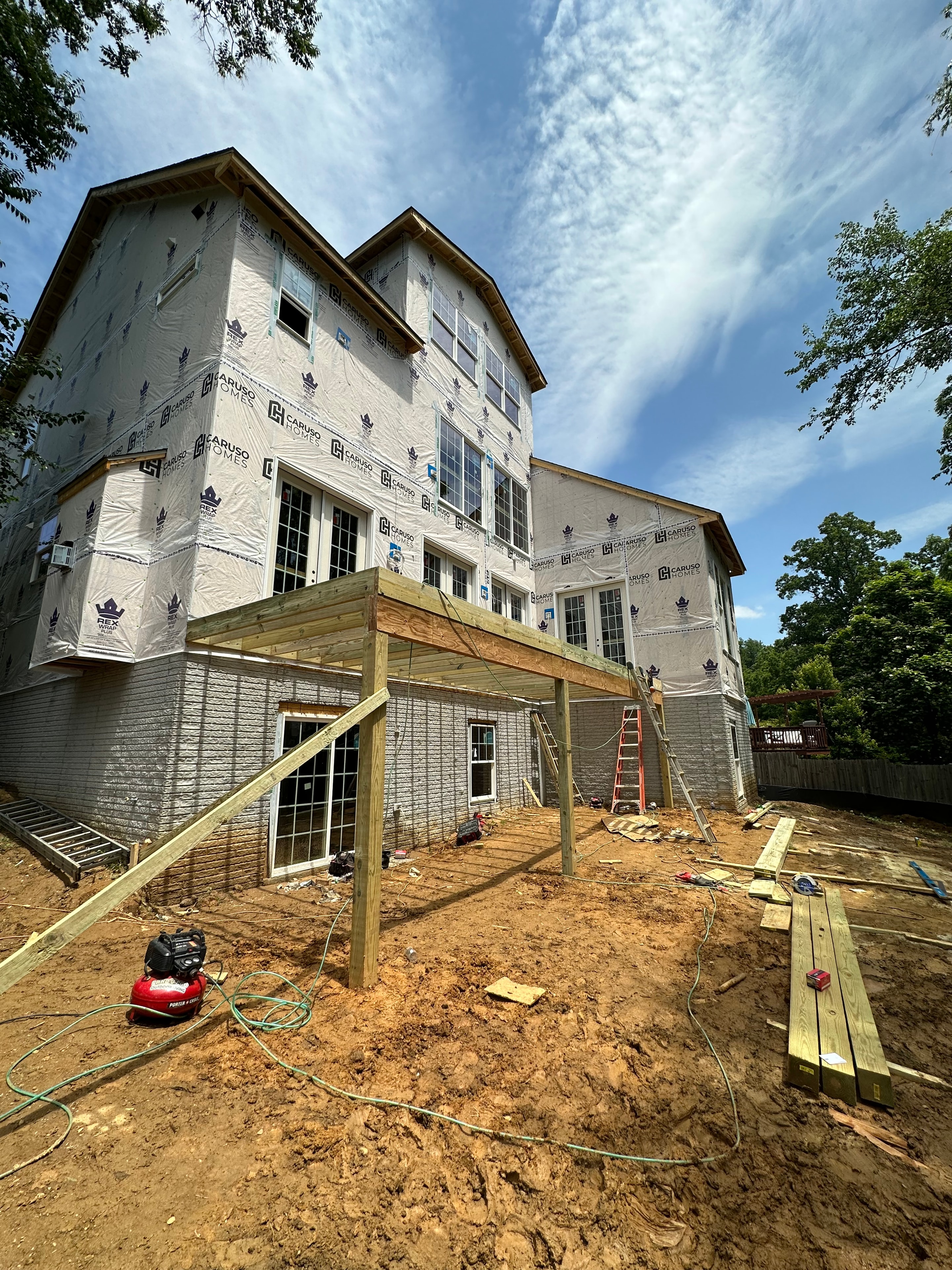 Big Deck Energy - early framing of 2-story deck structure