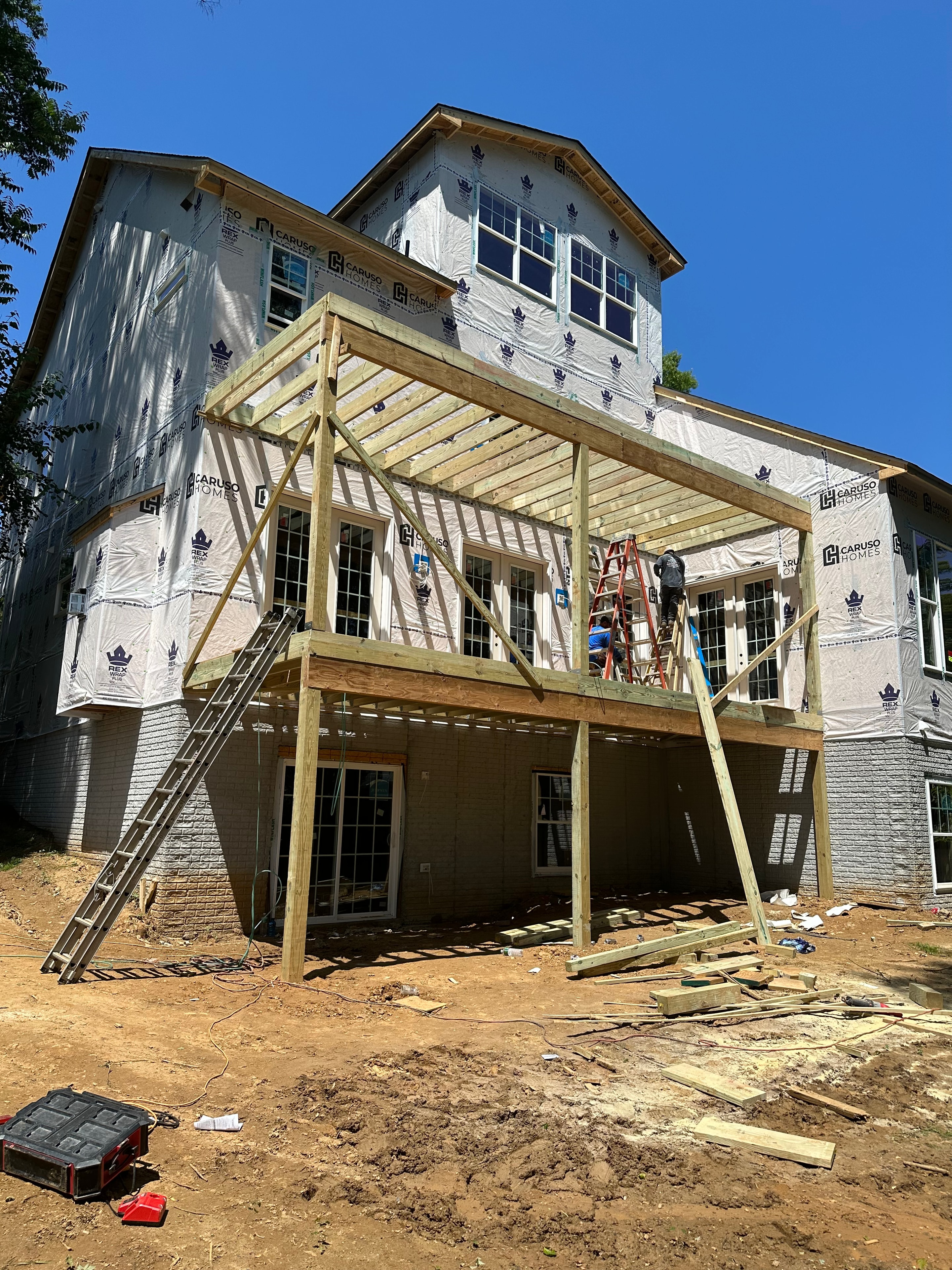 Big Deck Energy - deck framing progress from ground level